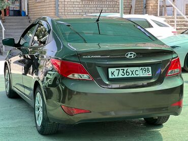 подлокотник нексия 1: Современный седан Hyundai Solaris, выполненный в коричневом цвете