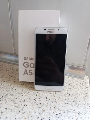 telefon sekilleri: Samsung Galaxy A5 2016, 16 ГБ, цвет - Белый, Отпечаток пальца, Две SIM карты