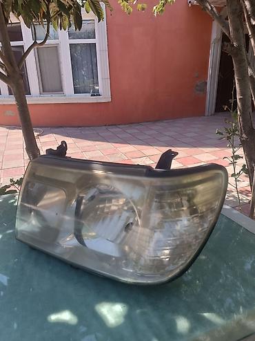 bmw e36 kapot: Toyota Land Cruiser 100 fara ( 2005 ) qabaq ( on ) sag fara original — 2
