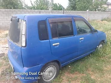 араб 2 бака: Nissan Cube (кузов Z10), правый руль, хэтчбек 5‑дверный. Цвет синий — 6