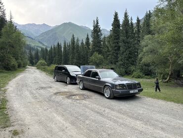 лобовое стекло на мерс 124: Седан Mercedes-Benz темного цвета, оснащенный фаркопом