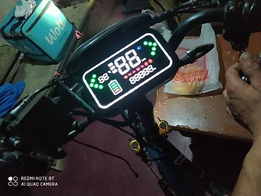 velosiped mingecevir: Elektrikli velosiped / moped tipli nəqliyyat vasitəsi. Şəkillərdə qara — 1