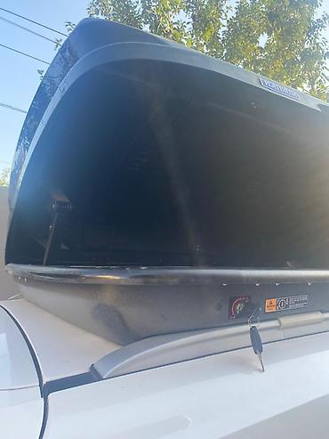 baqaj dam: Avtomobil üçün dam üstü baqaj qutusu (roof box). Aerodinamik formalı — 3