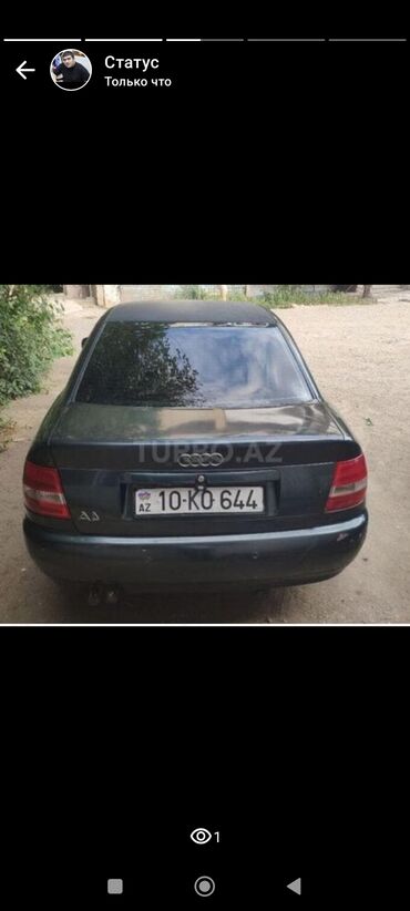 Opel: Audi A4 sedanı (B5 kuzov). Rəng: tünd boz. 4 qapı, ön və arxa LED