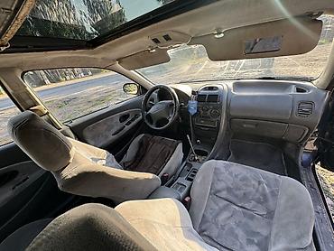 Унаа: Mitsubishi Carisma: 1998 г., 1.6 л, Кол менен иштөөчү, Бензин, Седан — 3