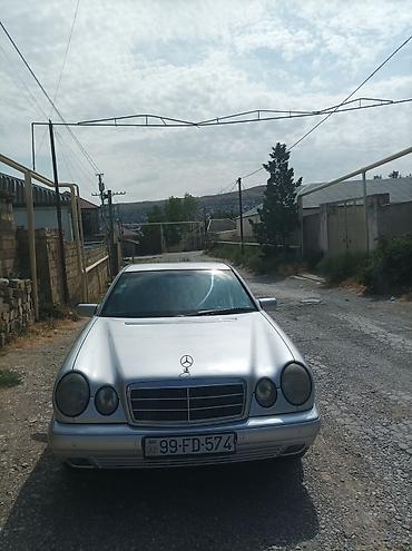 volkswagen polo 1: Mercedes-Benz E‑Class (W210) sedan – gümüş rəng. 1998 çi il 2.2 — 1