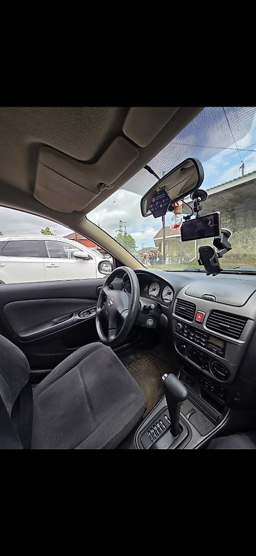 hyundai i30 oluxanası: Nissan Sunny: 1.6 l | 2007 il Sedan — 2
