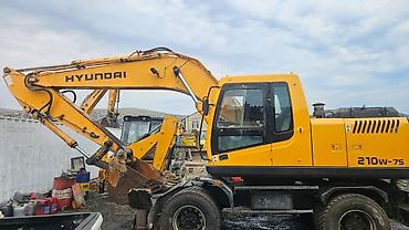 Hyundai 210W-7S təkərli ekskavator Xüsusiyyətlər: - Model: Hyundai
