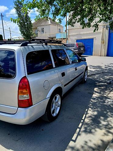 opel astra xectbek: Opel Astra Caravan (Universal) – gümüşü rəng Xüsusiyyətlər: - Kuzov — 9