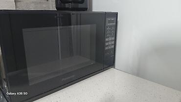ucuz printer satilir: Panasonic mikrodalğalı soba – model NN-ST25HB - Rəng: qara, şüşə ön — 1
