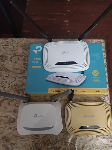 wifi adapter: Белый Wi-Fi роутер TP-Link модели N300, оснащенный двумя внешними — 2