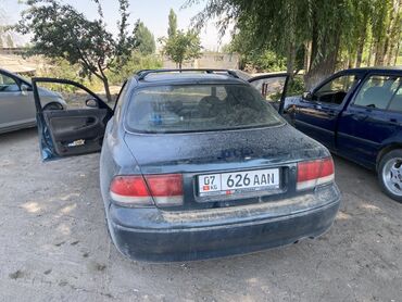 авто в рассрочку без первоначального взноса: Автомобиль седан с четырьмя дверями, представленный в тёмном цвете