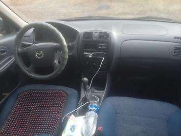 губа 211: Mazda 323: 2000 г., Механика, Бензин — 5