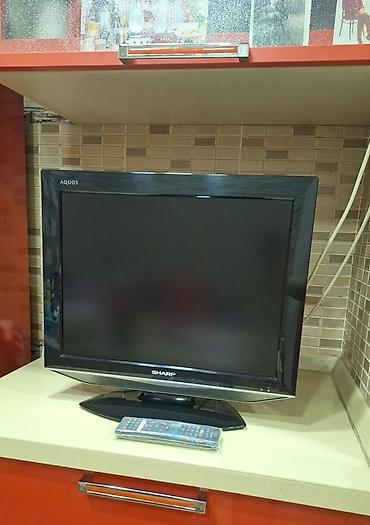 Televizorlar: Sharp Aquos LCD televizor - Ekran: təxminən 24–26 düym, geniş ekran - — 1