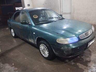 Daewoo: Model: Daewoo Nubira (sedan) Rəng: Tünd yaşıl Yanacaq növü: Benzin — 1