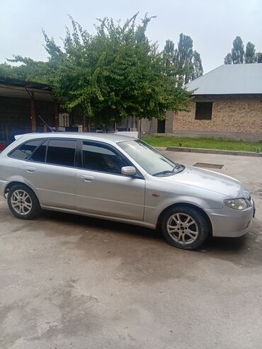 спец машина: Mazda 323: 2003 г., 1.3 л, Механика, Бензин, Хэтчбэк
