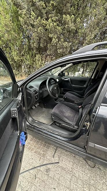 reno grand senik: Opel Astra Caravan (universal kuzov) - Geniş salon və iri baqaj: arxa — 2