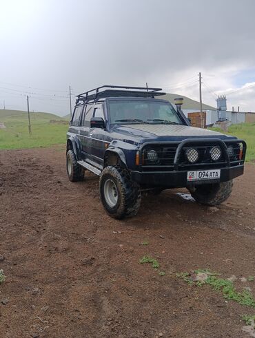 авто для охоты: Полноприводный внедорожник Nissan Patrol, оснащенный силовым бампером
