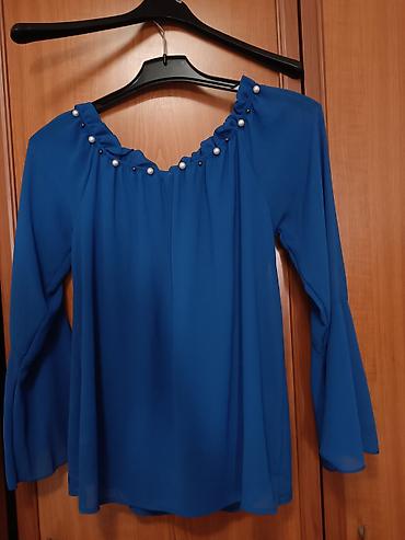 lil solid accessories: Elegantna ženska bluza u plavoj boji. Model sa širokim, lepršavim — 1