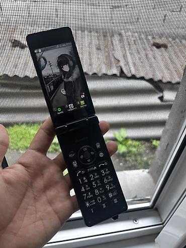 Другие мобильные телефоны: Два телефона. 1) Кнопочный раскладной телефон NTT Docomo (японская — 2