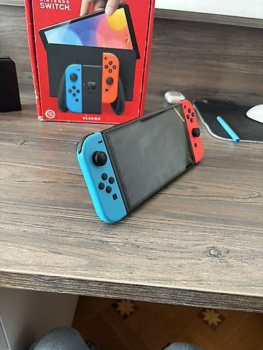 nintendo switch cip: Nintendo Switch OLED (Neon Blue/Neon Red) oyun konsolu - 7.0 düym — 2