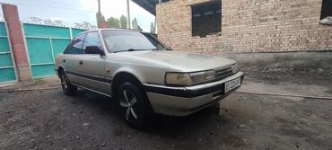 дизельный машины: Mazda 626: 1988 г., 2 л, Механика, Бензин, Седан