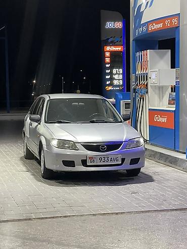 мини электро: Mazda 323: 2003 г., 1.3 л, Механика, Бензин, Хэтчбэк — 1