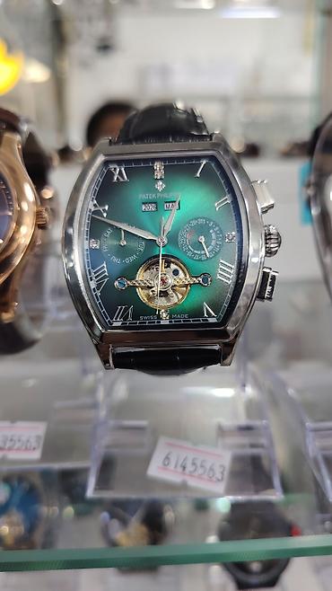 saat omega: Patek Philippe kişi qol saatı – tonneau (yastıqsayağı) korpus dizaynı — 4