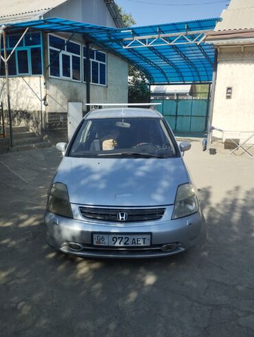 купить запчасти на опель вектра б: Минивэн Honda Stream серебристого цвета с характерной эмблемой Honda