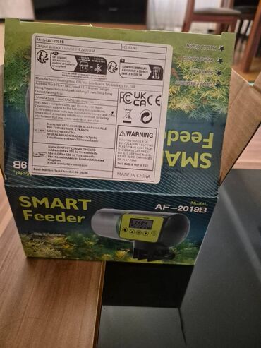 idman elcekleri: Akvarium üçün avtomatik balıq yemləyən