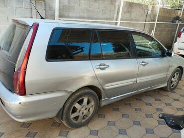 диск на sprinter: Mitsubishi Lancer в кузове универсал с серебристым цветом кузова