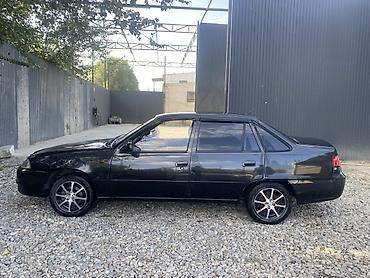 салон автомобиля: Daewoo Nexia: 2011 г., 1.5 л, Седан — 6