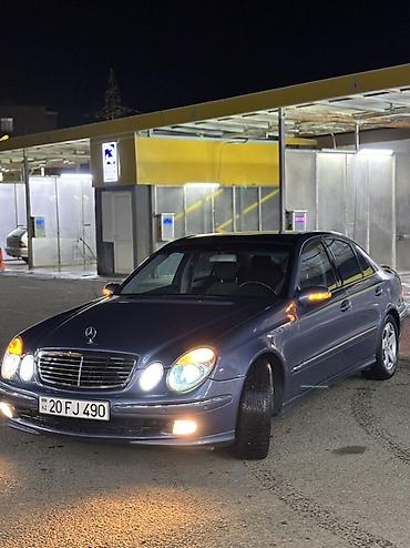 cls 63 amg: Mercedes-Benz E 200: 2 l | 2004 il Sedan — 3