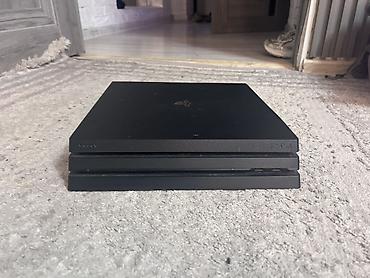 пл: Игровая приставка Sony PlayStation 4 Pro. Модель в фирменном черном — 4