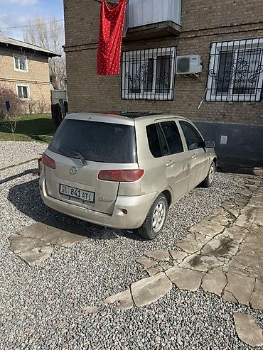 боковой тырмоо: Mazda Demio: 2003 г., 1.5 л, Автомат, Бензин, Хэтчбэк — 5