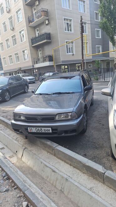 футболка или рубашка: Nissan Primera: 1996 г., 1.6 л, Механика, Бензин, Универсал