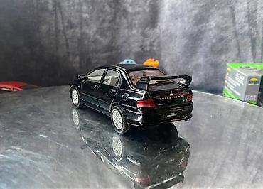 Avtomobil modelləri: Коллекционная модель Mitsubishi Lancer Evolution VII black 2002 — 10