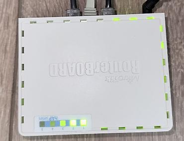 Модемы и сетевое оборудование: Маршрутизатор MikroTik RouterBOARD hAP ac lite (RB952Ui-5ac2nD) - — 1