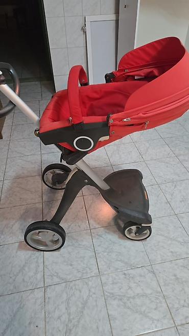 usag maneji: Stokke uşaq arabası satılır. Parlaq qırmızı rəngdə olan bu model — 1