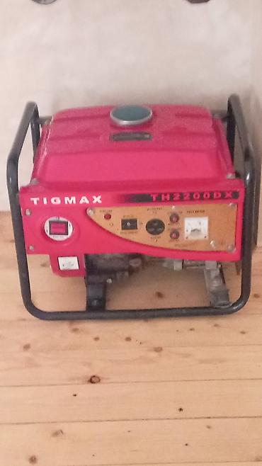 qamak satilir: TIGMAX TH2100DX benzinli generator - Daşıma üçün möhkəm metal çərçivə — 1