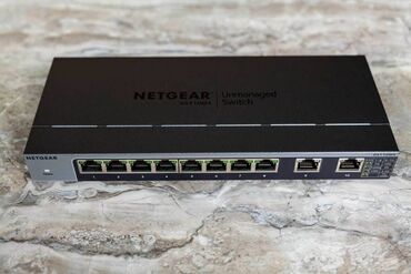 Модемы и сетевое оборудование: NETGEAR 10-портовый Gigabit/10G Ethernet Unmanaged Switch (GS110MX) 8