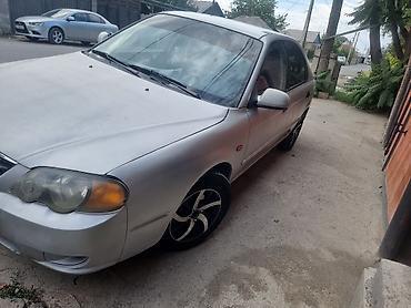 range over: Kia Spectra: 2002 г., Механика, Бензин, Седан — 2