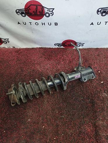 амортизаторы демио: Амортизатор передний Mazda Demio DW3W, 1.3 (2000 г.) - Полная стойка в — 1