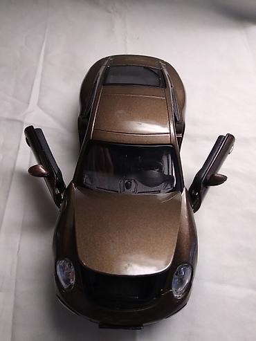 casio zeleni sat: Burago Porsche 911 Carrera S,fale 4(a ne 3) tocka,ostalo ok,China — 2