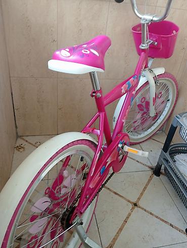 velo disk: Uşaq velosipedi. Parlaq çəhrayı rəngdə dizayna malikdir. Velosipedin — 1