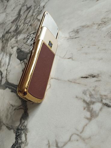 herbi telefon: Qızılı-rəng korpuslu, sürüşdürülən korpus dizaynlı düyməli mobil — 3