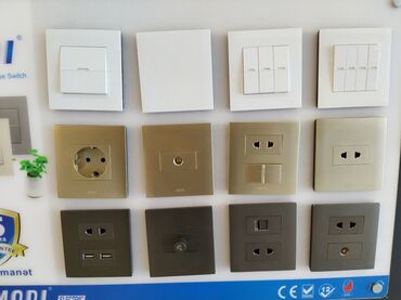 electron saatlar: Müxtəlif dizayn və rənglərdə elektrik açarları və rozetkaları. Eviniz
