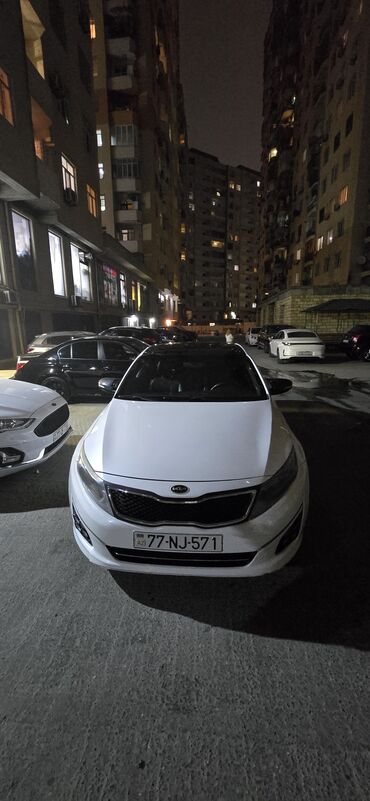 Kia: Kia Optima – ağ rəngli sedan Xarici: - Ağ kuzov, qara panoramik dam - — 9