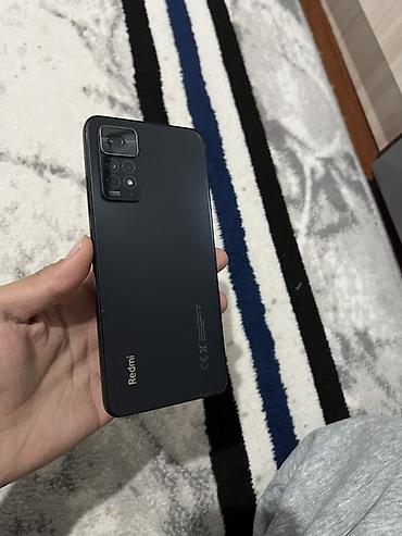 Редми нот 11 про Смартфон Redmi в чёрном цвете. Корпус выполнен в