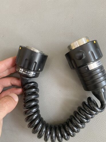 ayfon adapter: Olympus MH-976 modelinə aid olan bu spiral kabel iki ucunda
